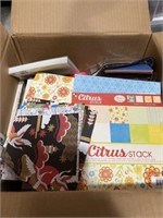 Lot of crafting paper, scissors, stencils, and