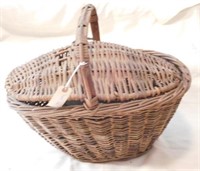 Old Wicker basket full of vintage Hires sofa