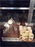 Coffee mugs candleholders pitcher and vase