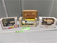 4 Collectible toy banks in original boxes