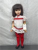 Large plastic doll with bown hair
