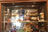 Collectibles on Top Shelf of in Curio