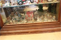 Collectibles on Bottom Shelf in Curio