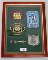 Framed Calgary Police badges and patches