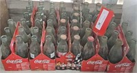 Coca-Cola glass bottles in cardboard holders