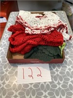 Lot of red green and white doilies
