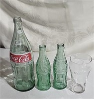 Coke bottles and glass