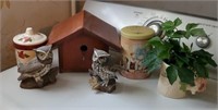 Birdhouse with ceramic owls, mug, tins, candles