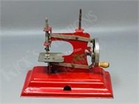 vintage toy sewing machine, metal still turns
