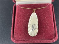 Mammoth ivory scrimmed necklace by R.W. pendant is