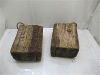 blocks of wood with rope attached