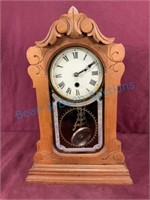 Antique clock in walnut case