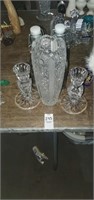 2 candle holders, 1 vase, and 2 bottles