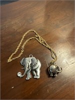 Two costume elephant pendants