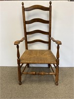 Early ladder back rush seat armchair