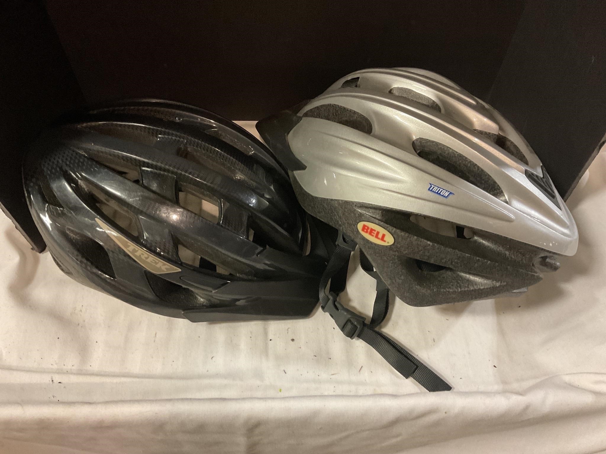 Two bicycle helmets