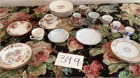 Assortment of tea cups, saucers, plates