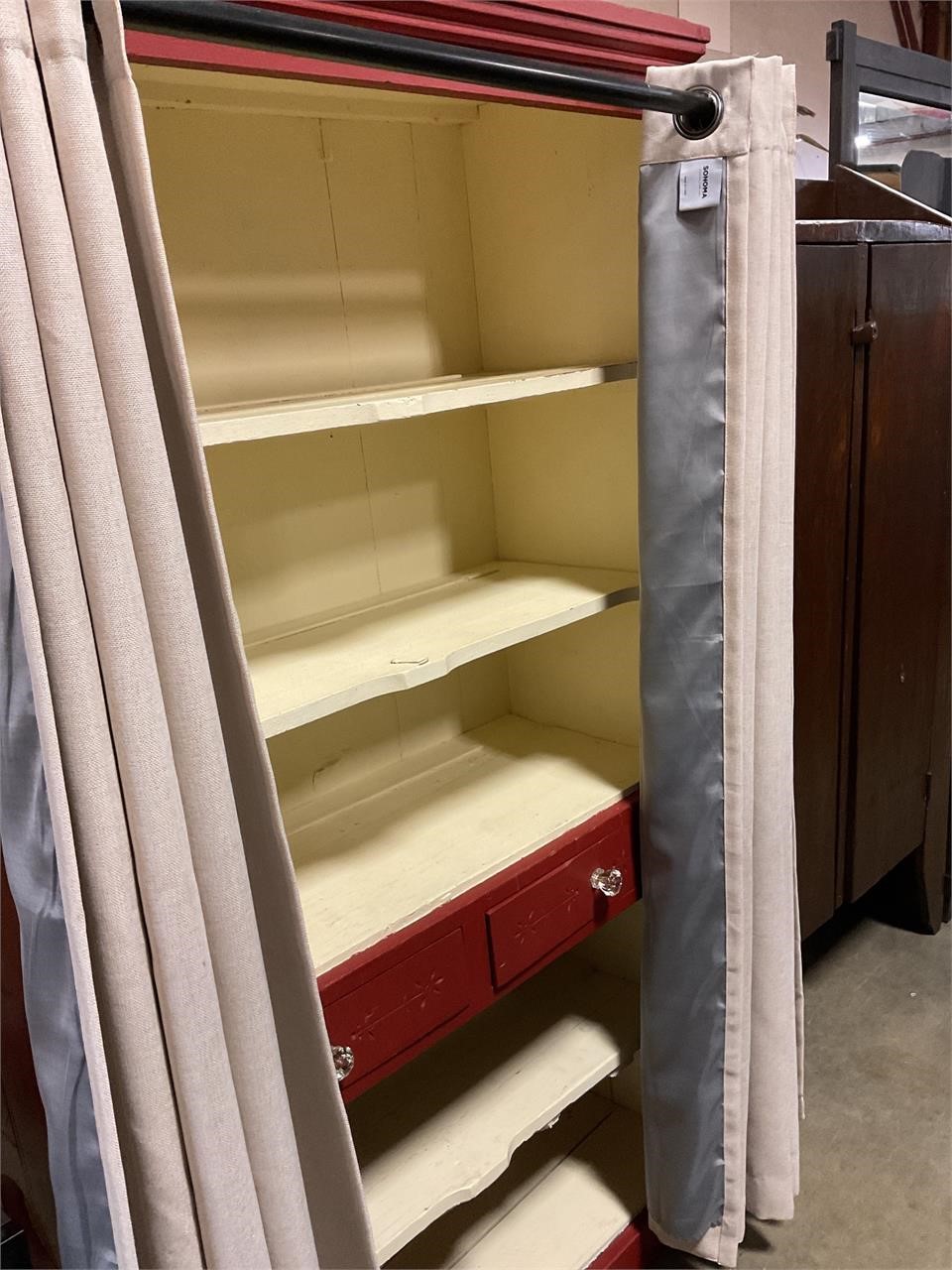 Pantry with curtains and shelves