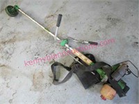 green straight shaft weed eater (gas mix powered)