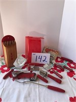 Various red wood handled utensils