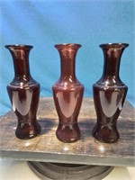 Set a 3 ruby glass bud vase as 6 inches tall