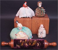 Five pin cushions including figurals with