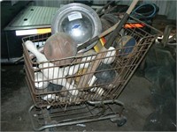 Grocery cart filled with balls, bowling poins,