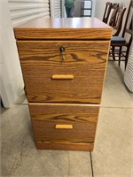 Two drawer oak finish file cabinet with key