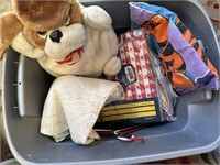 tote with table cloths and stuffed animal