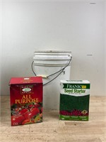Two large buckets with plant food/seed starter