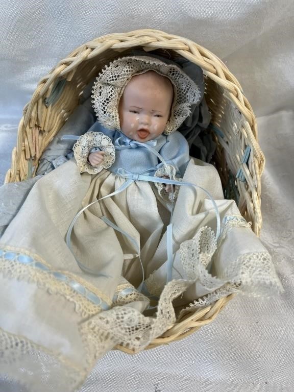 Porcelain baby crib and christening dress crying