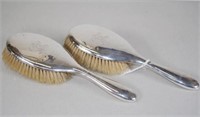Pair George V sterling silver backed brushes