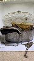 Group of older clutch purses and bigger vanity
