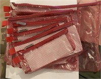 Seven piece red travel zipper pouches