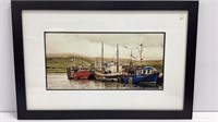 Framed photograph of fishing trawlers, matted