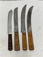 4 knives.  10” to 12” blades. Wood handles.