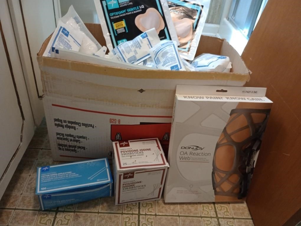 Box full of medical supplies and scales