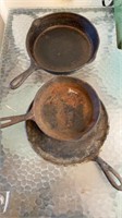 3 cast iron skillet pans , flat iron and two
