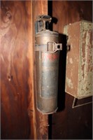 Fire-Gun No. 0 fire extinguisher with wall