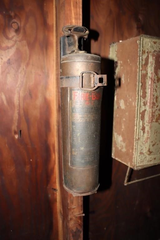 Fire-Gun No. 0 fire extinguisher with wall