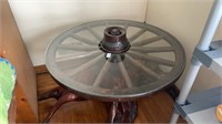 Vintage wooden wagon wheel table with hand carved