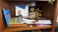 Shelf lot with puzzle books and Kenny Rogers