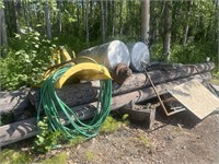 Pile #2- 2 snowplows, gas tanks, telephone poles