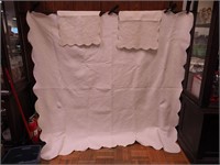 Heavily quilted bedspread with white modified