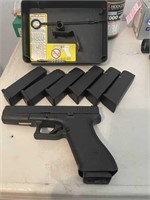 Glock 22 handgun  with extra magazines