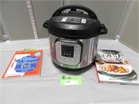 Instant Pot with recipe books; never used per sell
