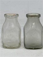 -2 half pint milk bottles, and two milk bottle