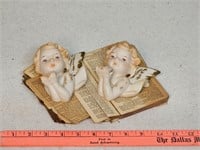 Arco wall cherubs on antique books