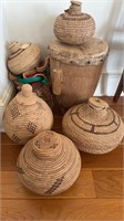 Collection of five woven baskets with lids, and a