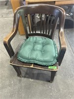 Wooden chair with green pad